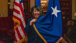 Military personnel with flag