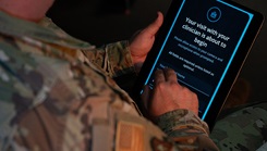 Military personnel using an Ipad