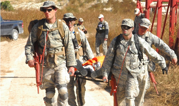 Airmen from the 460th Medical Group use a litter to carry a patient during a training exercise at Fort Carson, Colo. The 460th MDG completed annual combat leadership and combat medic training in order to prepare themselves for situations they could find themselves in while deployed in a hostile environment. (Courtesy photo)