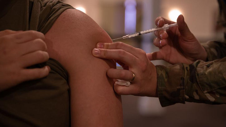 Image of A female airman being injected into her arm with her first COVID-19  vaccination at Barksdale Air Force Base, Shreveport, Louisiana Sept. 9, 2021.