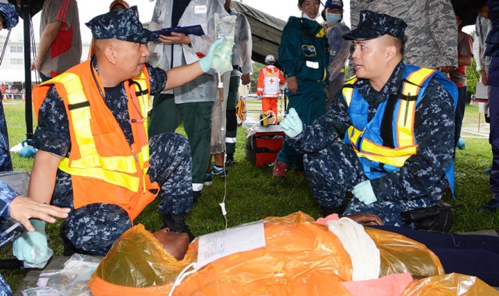 Navy Lt. Cmdr. Reginaldo Cagampan, left, and Navy Hospital Corpsman 1st Class Rocky Pambid, members of the U.S. Naval Hospital Yokosuka Emergency Response Team, treat a simulated patient during the 2016 Big Rescue Kanagawa Disaster Prevention Joint Drill in Yokosuka city, Japan. Multiple agencies took part in the drill including the U.S. Navy, Army and Air Force, as well as personnel from the Japan Self-Defense Force and Japanese government agencies. (U.S. Navy photo by Greg Mitchell)