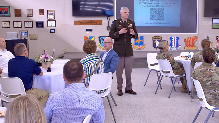 U.S. Army Col. Vincent B. Myers, commander of Blanchfield Army Community Hospital talks with TRICARE network providers from the local community about the hospital's medical mission during a network partner event on Fort Campbell, Kentucky, on April 13. Regional TRICARE contractors provide health care services and support beyond what's available at military hospitals and clinics for eligible beneficiaries. (Photo by Fred Holly, Blanchfield Army Community Hospital)