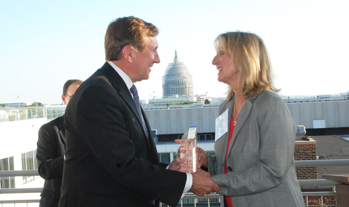 David Bowen, director of the DHA Health Information Technology directorate, receives the Health Information and Management Systems Society (HIMSS) Health IT Federal Leadership Award from Dana Alexander, chief of the HIMSS board of directors, during the group’s awards reception Oct. 7, 2015, in Washington, D.C. The awards highlight the leadership Bowen exhibited in consolidating, streamlining and standardizing health IT services in support of the long-term success of Military Health System IT resources.
