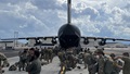 Paratroopers prepare to board a U.S. Air Force C-17 at Fort Bragg, North Carolina.