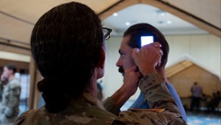 U.S. Army Lt. Col. Wendra Galfand, director of medical education and research at Womack Army Medical Center, operates an intercranial hemorrhage assessment device during a Soldier touchpoint event, Fort Liberty, N.C., Sept. 18, 2024.