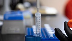 military personnel researching enzymes in a lab
