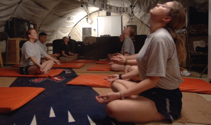 Link to Photo: Airmen and Soldiers practice breathing and relaxation during their off duty time in a deployed location. Stress can take its toll on your mental and physical health, including your heart health, but there are breathing techniques to buffer yourself from it. (U.S. Air Force photo by Master Sgt. Lance Cheung)