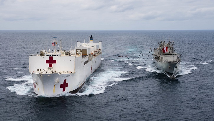 The hospital ship USNS Comfort (left) receives a fuel probe from the Peruvian ship B.A.P. Tacna during replenishment-at-sea practice. Comfort is working with health and government partners in Central America, South America, and the Caribbean to provide care on the ship and at land-based medical sites, helping to relieve pressure on national medical systems strained by an increase in Venezuelan migrants. (U.S. Navy photo by Mass Communication Specialist 2nd Class Morgan K. Nall)
