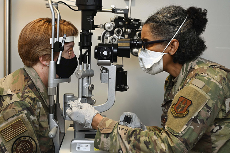 Air Force and Space Force Surgeon General Lt. Gen. Dorothy Hogg receives an eye exam from Air Force Reserve Maj. Leslie Wilderson at Joint Base Anacostia-Bolling, Washington, D.C., March 26, 2021. Photo By: Air Force Staff Sgt. Kayla White