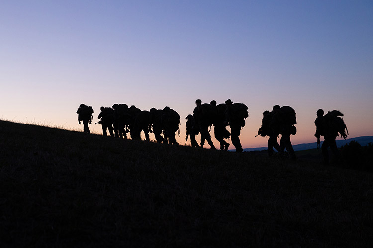 Image of Marines hike to the next training location during Exercise Baccarat in Aveyron, Occitanie, France, Oct.16, 2021. Exercise Baccarat is a three-week joint exercise with Marines and the French Foreign Legion that challenges forces with physical and tactical training. Photo By: Marine Corps Lance Cpl. Jennifer Reyes.