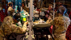 U.S. airmen assigned to the 920th Aeromedical Staging Squadron Critical Care Air Transport Team perform medical care while on an HC-130J Combat King II aircraft during a quarterly live-flight patient simulation training off the coast of at Patrick Space Force Base, Florida, Aug. 5, 2024. 