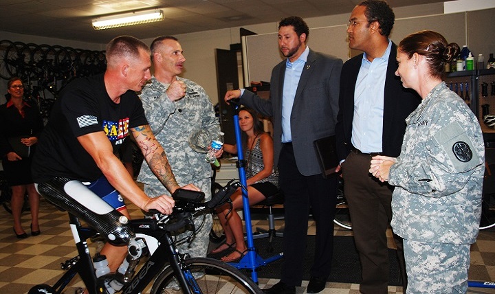 Warrior Transition Battalion Commander Army Lt. Col. Michael Harper speaks to Rep. Will Hurd during the Adaptive Reconditioning demonstrations as Army Staff Sgt. Allen Armstrong (far left), Jon Arnold (center), and Army Sgt. 1st Class Samantha Goldensten (far right), WTB Soldier Adaptive and Reconditioning Program noncommissioned officer in charge look on. 