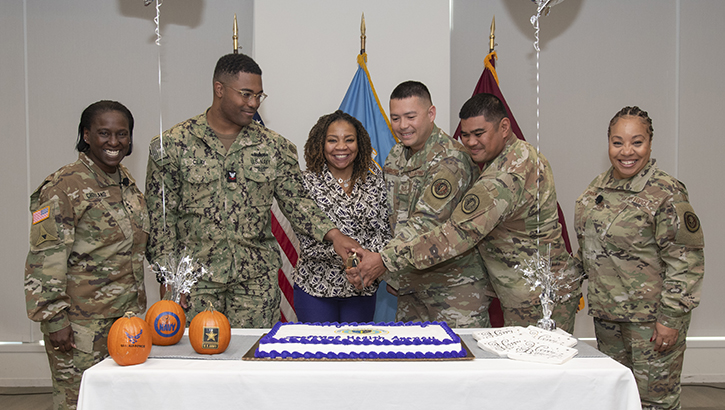 Image of U.S. Army Lt. Gen. Telita Crosland, director of the Defense Health Agency, poses with U.S. Navy Petty Officer 2nd Class Billy Clay Jr.; Natalie Noland, DHA; U.S. Air Force Tech. Sgt. Robert Camacho, U.S. Army Master Sgt. Roberto Jerome Jr., and U.S. Air Force Command Chief Master Sgt. Tanya Johnson, DHA senior enlisted leader.