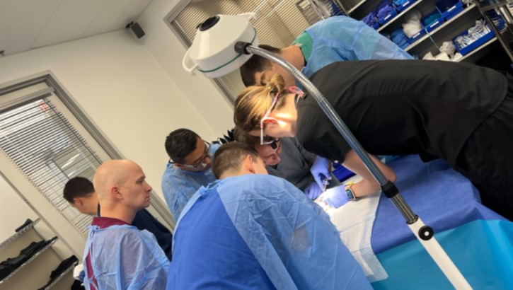 Orthopaedic residents are lead through hand prosection by a Hand Surgery Faculty member. 