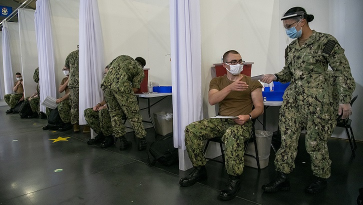 Image of Sailors receive COVID-19 vaccinations. Click to open a larger version of the image.