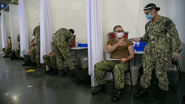 Image of Sailors receive COVID-19 vaccinations.