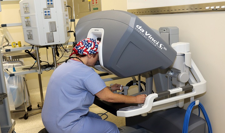 Lieutenant Colonel Kimberly DeVore, chief of Evans Department of Obstetrics and Gynecology, practices with the da Vinci surgical system control modular. 