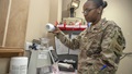 Military pharmacist counting pills