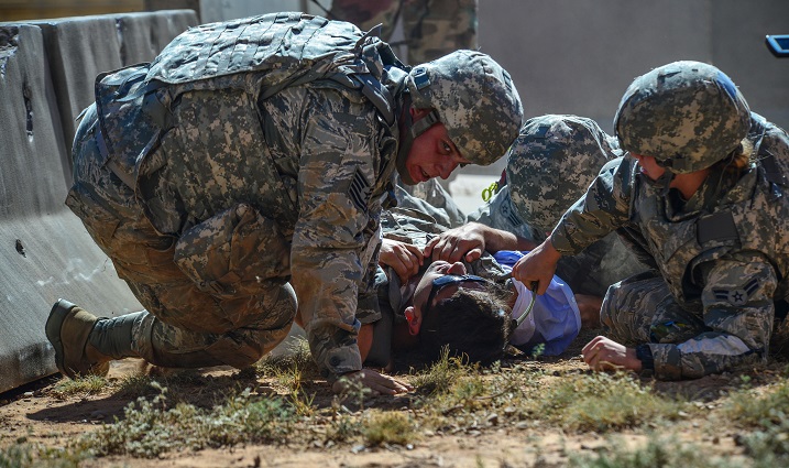Air Force Medics from Langley Air Force Base, Va., pull a simulated patient to safety at Melrose Air Force Range, N.M. Twenty-one teams of elite Emergency Medical Technicians from 22 installations across the Air Force convened at Cannon Air Force Base, N.M., for two days of competition. Throughout the rodeo, teams were required to execute lifesaving missions under the critical eye of expert evaluators, demonstrating accurate techniques and effective implementation. (U.S. Air Force photo by Airman 1st Class Shelby Kay-Fantozzi)