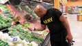 Military personnel picking out broccoli