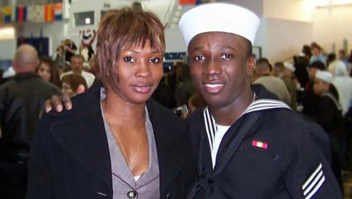 Navy Ensign Roland Kiendrebeogo, a first-year medical student at the Uniformed Services University, with his wife at his enlisted boot camp graduation, May 2010.