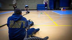  Chief Hospital Corpsman Joanna Rakes, assigned to Naval Medical Forces Atlantic (NMFL), pulls a weighted bag during command-sponsored physical training