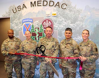Military personnel at ribbon cutting ceremony