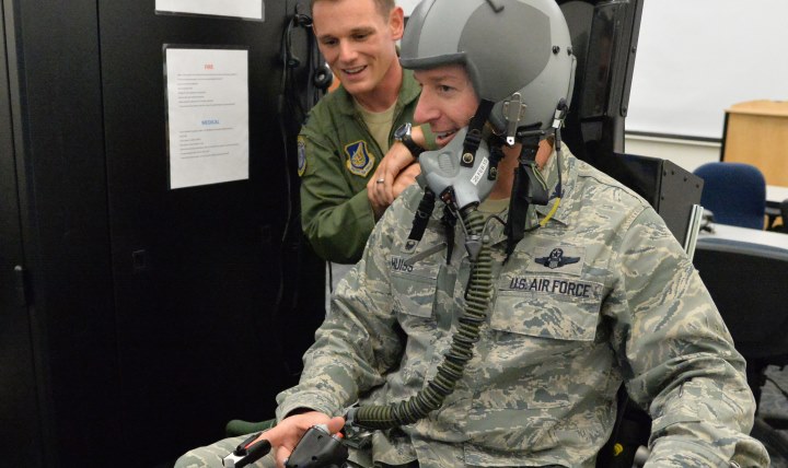 Col. Randy Huiss, 15th Wing commander, receives instruction form Capt. Timothy Plant, 15th Aerospace Medicine Squadron officer in charge of aerospace and operational physiology, prior to hypoxia training on Joint Base Pearl Harbor-Hickam, Hawaii, Jan. 22, 2015. The training is conducted using a Reduced Oxygen Breathing Device that induces the early onset of hypoxia, helping aircrew members to know and understand how it feels to become hypoxic. (U.S. Air Force photo by Staff Sgt. Alexander Martinez/Released)