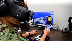 A naval aviation candidate uses a virtual reality (VR) testing station equipped with Assessing Spatial Abilities in Naval Aviation (ASANA) to gather data used in the updating and implementation of the Aviation Standardized Test Battery