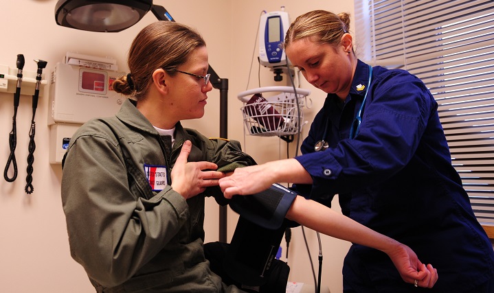 While active-duty women do get regular health check-ups, women who leave active duty, and dependents need to make sure they remain diligent about keeping track of their health. Coast Guard Petty Officer 2nd Class Charity Washko (right), a health services technician, wraps a blood pressure cuff around Petty Officer 3rd Class Charly’s arm. The vitals check information includes blood pressure, pulse and temperature which is recorded in a service member's medical record for every visit to a clinic. (U.S. Coast Guard photo by Petty Officer 3rd Class Jonathan Lally)