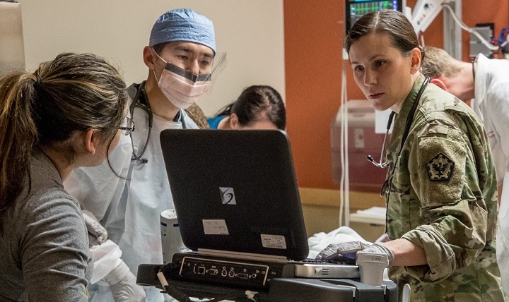 Staff at Madigan Army Medical Center in Tacoma, Washington, treat patients. The 2017 results of the Defense Department’s Joint Outpatient Experience Survey show an increase in patient satisfaction with military medical facilities and pharmacy care. (U.S. Army photo)