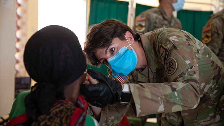 U.S. Army 2nd Lt. Dorothy Chiaravalle, assigned to 69th Infantry Regiment, 27th Brigade Combat Team, New York Army National Guard, performs a mouth assessment during a medical civic action program at Archer’s Post Sub County Hospital in Kenya on Feb. 18.  (Photo by U.S. Army Cpl. Genesis Miranda)