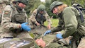 Military medical personnel during simulated trauma exercise