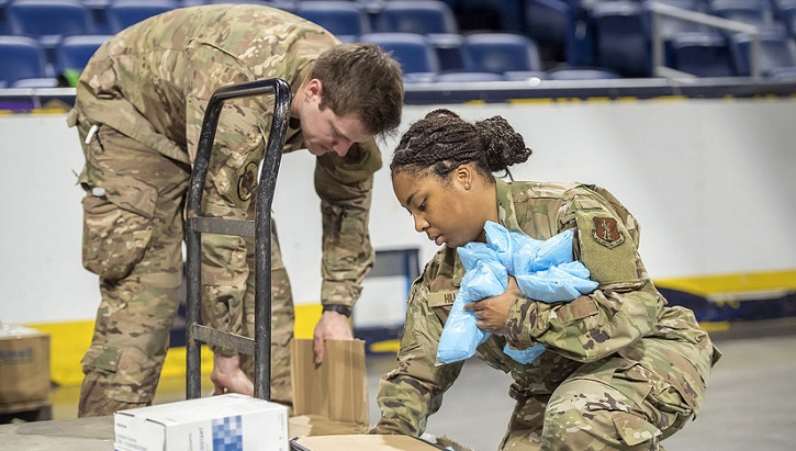 Image of two soldiers organizing medical supplies