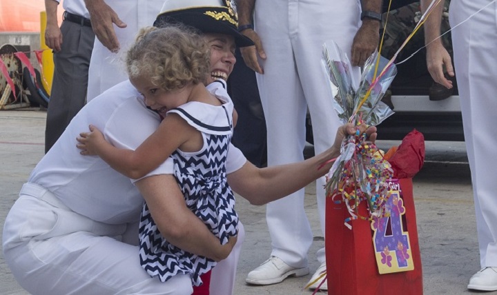 A daughter greets her mother after hospital ship USNS Mercy returns to homeport at Naval Base San Diego. Mercy completed a nearly 5-month deployment in support of Pacific Partnership 2015. (U.S. Navy photo by Mass Communication Specialist 3rd Class Eric Coffer)