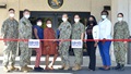 Military personnel pose for picture at NBHC