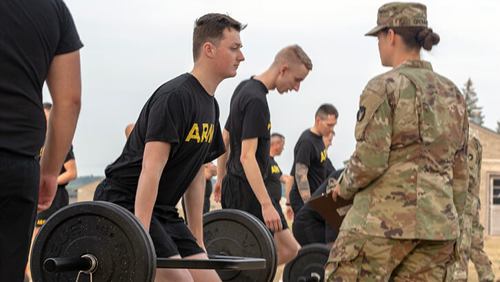 Image of Military personnel physically training. Click to open a larger version of the image.