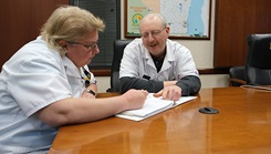 Medical Technicians Linda Jacobson and Don Roth review documentation together. The pair has been working together as a brother-sister duo for more than 30 years at the Milwaukee military entrance processing station. Medical technicians are vital to determining eligibility for those seeking to join the armed forces. 