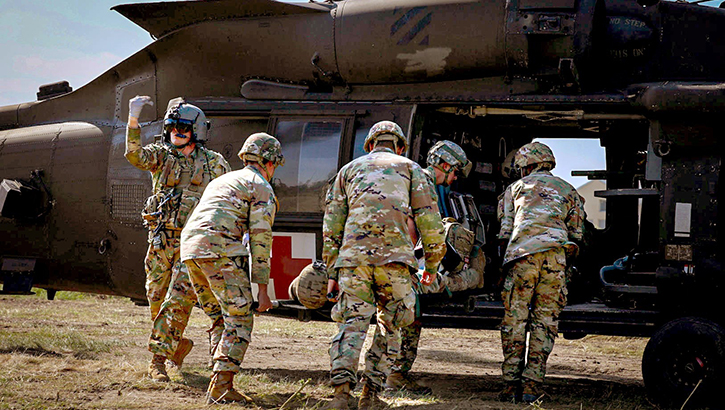 Soldiers assigned to 129th Area Support Medical Company and Forward Support MEDEVAC Platoon, 3rd Combat Aviation Brigade, 3rd Infantry Division, conduct patient movement operations for aeromedical evacuation during a training in Slobozia, Romania, on June 1. This year marks 106 years of support from medical service corps officers. (Photo: U.S. Army Staff Sgt. Laura Torres)