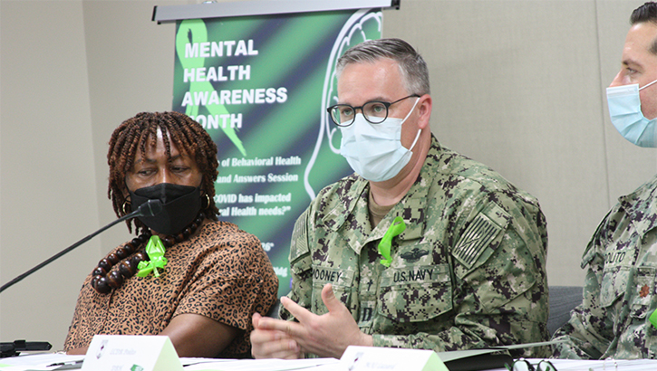 Image of Military personnel wearing face mask speaking on a panel. Click to open a larger version of the image.