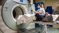 a patient prepares for a PET scan