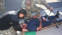 Patient is assessed in the triage area during a mass casualty response drill on Naval Air Station North Island. 