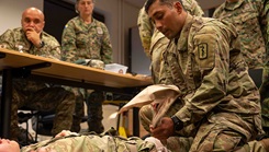U.S. Army Master Sgt. Mario Leonmiti, 512th Field Hospital emergency room platoon sergeant, applies a junctional tourniquet to a patient during the European Role 1 Development week at Ramstein Air Base, Germany, Sept. 16, 2024. 
