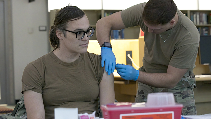 U.S. Navy Machinist's Mate 1st Class Vivian Jaquith, from the Naval Medical Research Command, receives a seasonal influenza vaccination. Flu vaccines were administered to military members and beneficiaries during a joint flu shot drive hosted by Walter Reed Army Institute of Research.  (Photo by Mike Wilson/U.S. Navy)