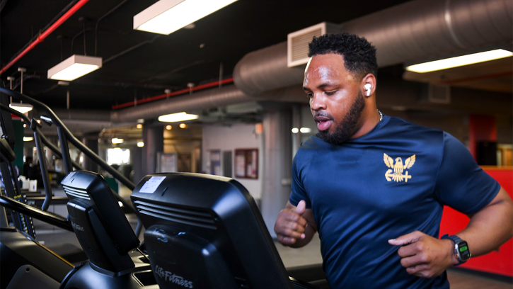 Chief Master-at-Arms Ryan Westfield runs on a treadmill during a Navy physical readiness test 