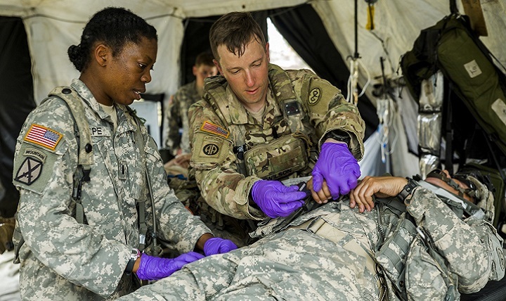 U.S. National Guard Sgt. Amanda Nelson, 466th Area Support Medical Company, works with Brazilian Army peers during Operation Paraná III in Parana, Brazil, on Aug. 15, 2023. The New York National Guard participated in the simulated humanitarian aid response exercise Aug. 12-19, 2023, as part of the Department of Defense National Guard Bureau State Partnership Program.
