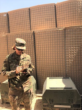 Image of soldier with a noise detector