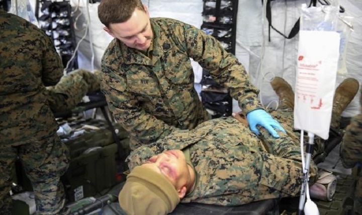 Seaman Dustin Nix, a corpsman with 2nd Medical Battalion, treats a role-player for injuries in preparation for their upcoming multinational exercise in Norway. The corpsmen treated similar injuries caused by cold weather, a climate they will experience in Norway. (U.S. Marine Corps photo by Cpl. Michael Dye) 