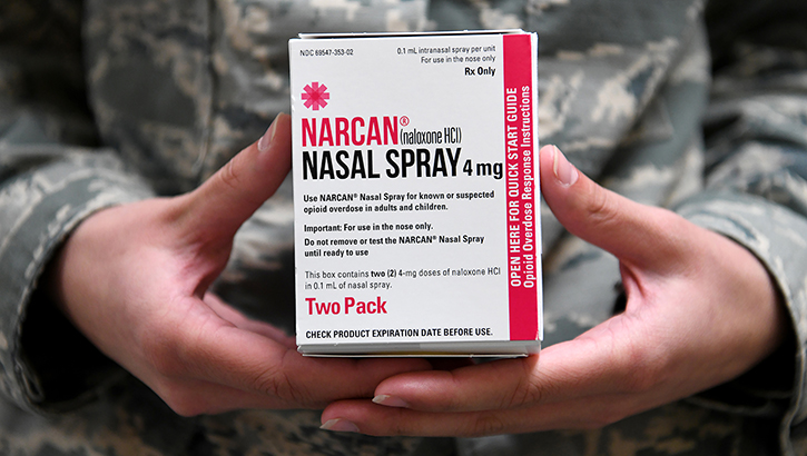 Airman holding Narcan, a brand of naloxone
