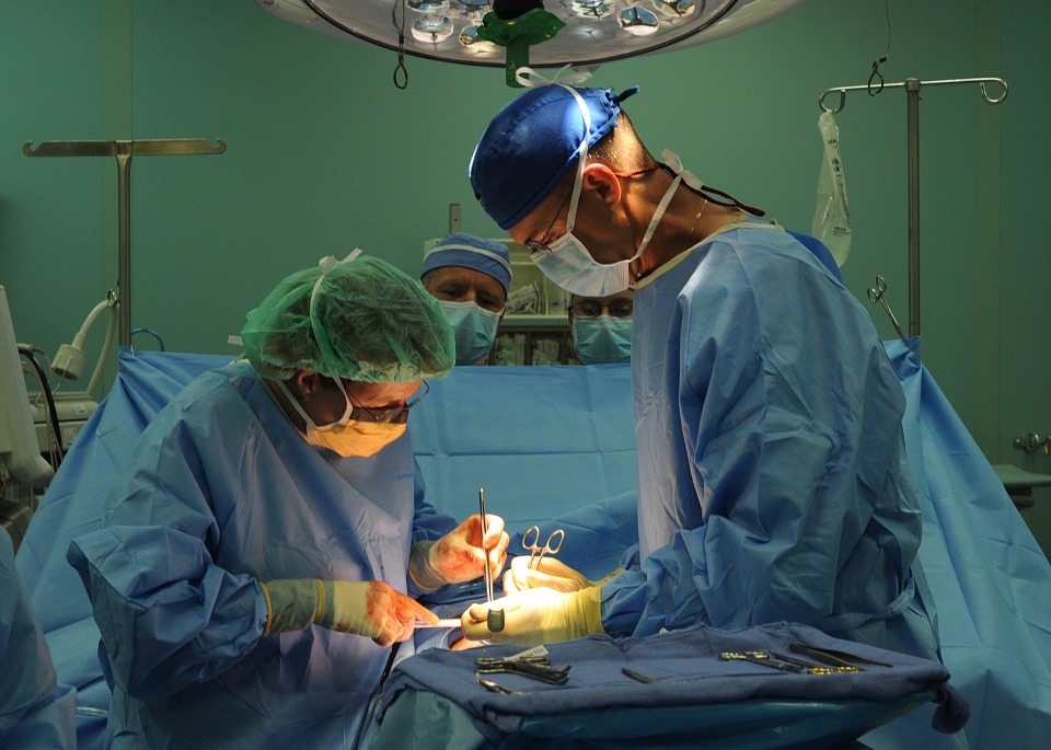 Doctors perform surgery in an operating room.